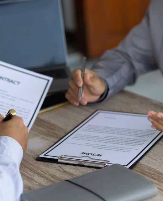 Job interview and signing of employment contract documents.